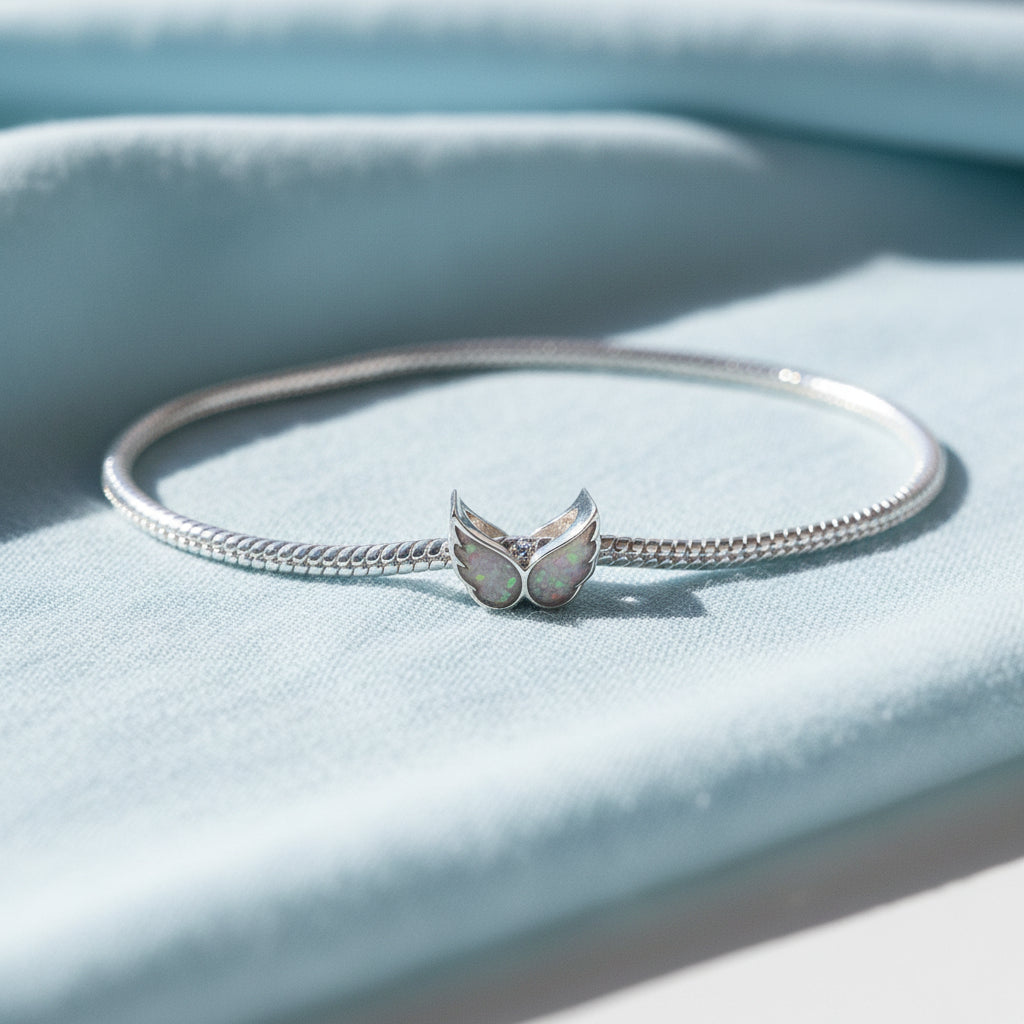 Heaven’s Embrace' Sterling Silver Angel Wing Memorial Charm.