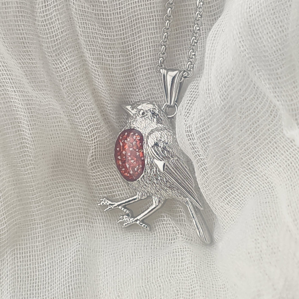 Robin pendant with a red opal breast memorial stone
