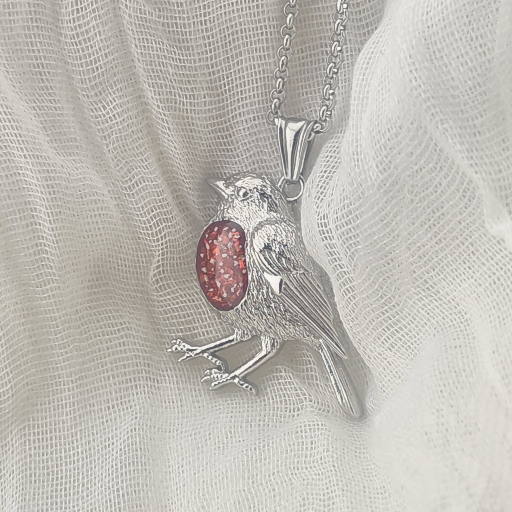 Robin pendant with a red opal breast memorial stone