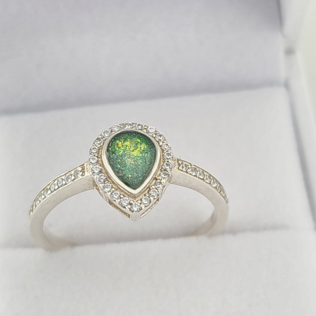 Silver ring with a green  memorial  stone