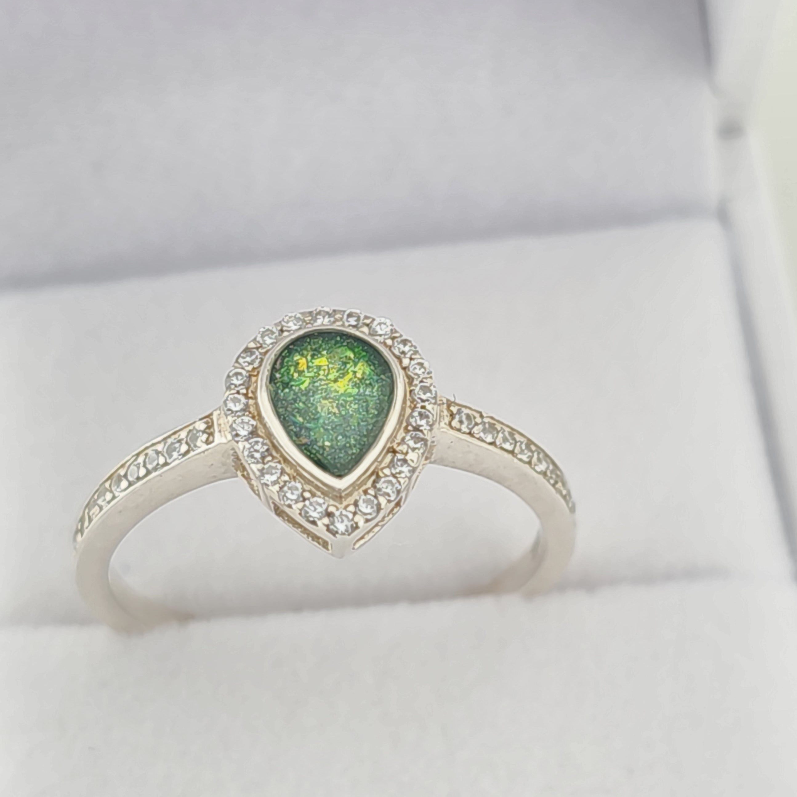 Silver ring with a green  memorial  stone