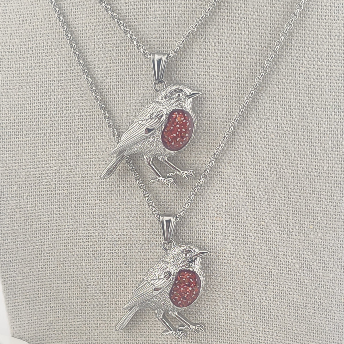 Stainless Steel Robin pendants with red memorial stones with ashes