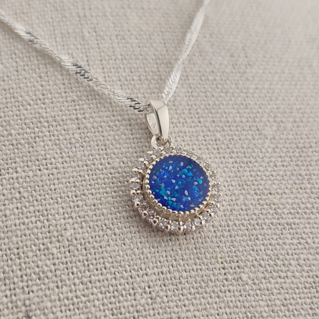 Tilly & Co Memorial Jewellery Ltd Celestia sterling silver pendant with a blue resin centre and crystal halo setting.