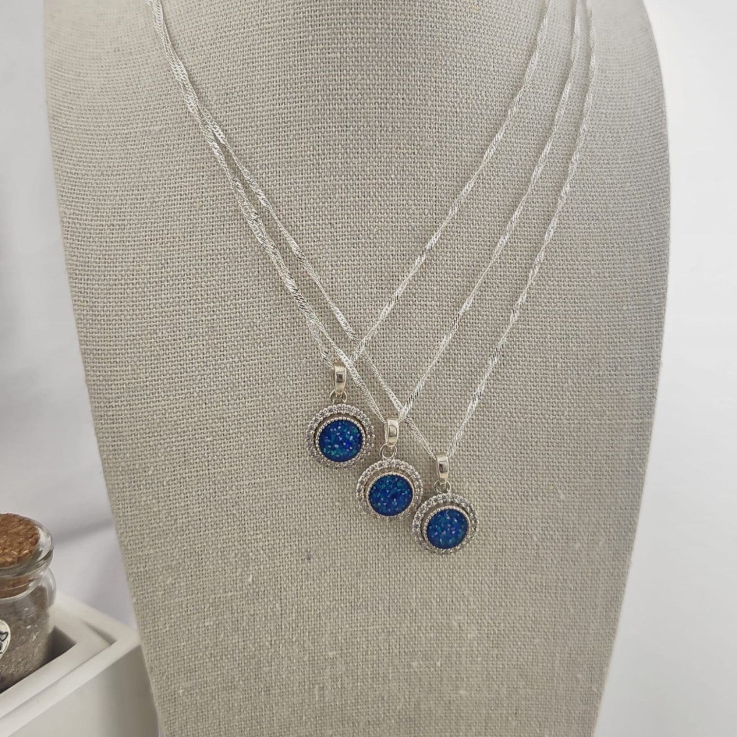 Tilly & Co Memorial Jewellery Ltd Celestia sterling silver crystal halo memorial pendants with blue resin settings