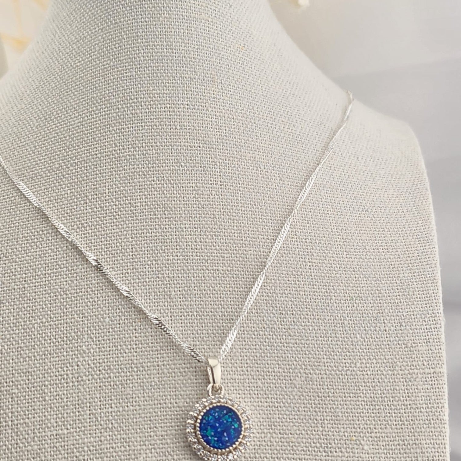 Tilly & Co Memorial Jewellery Ltd Celestia sterling silver pendant with a blue resin setting and crystal halo