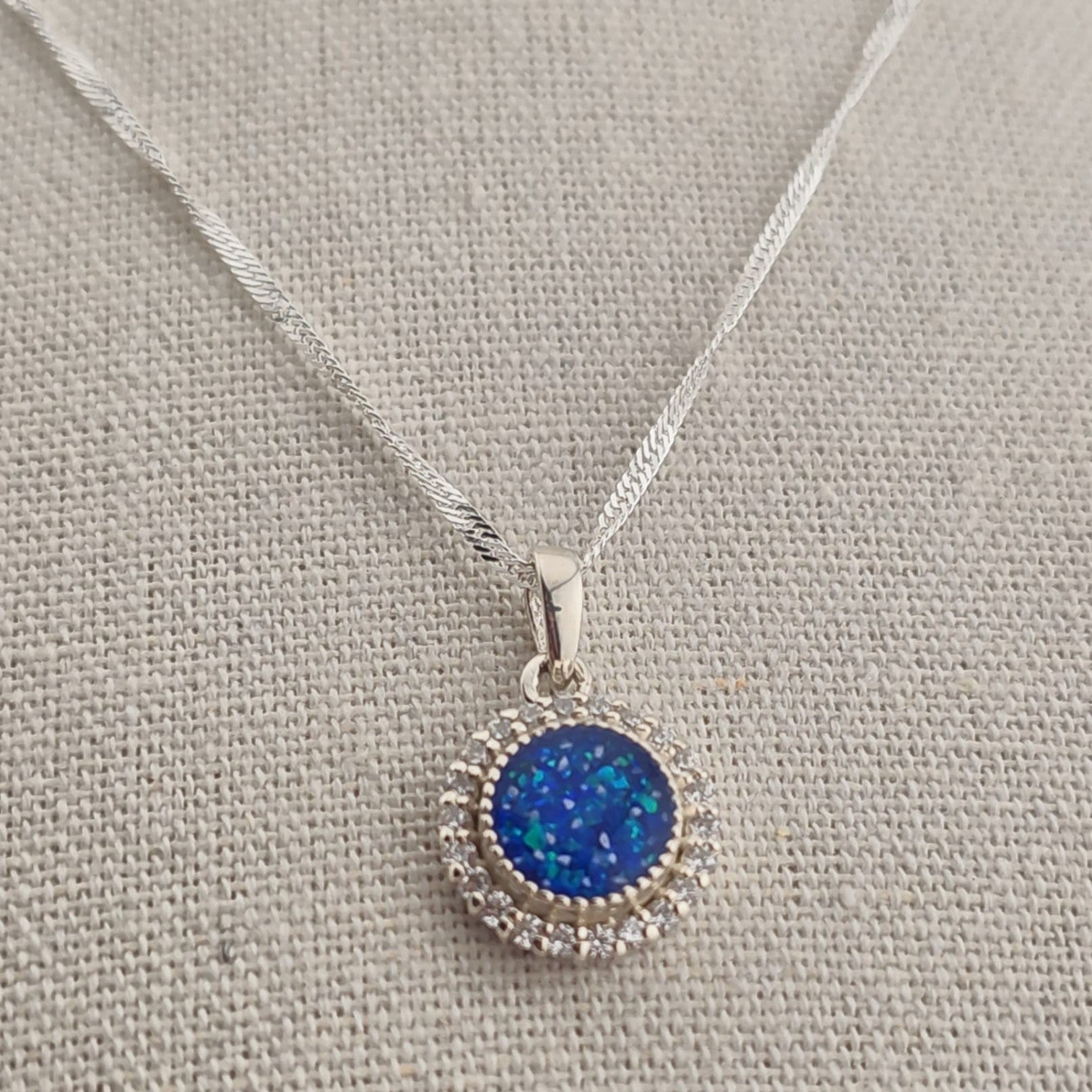 Tilly & Co Memorial Jewellery Ltd Celestia sterling silver pendant with a blue resin centre and crystal halo