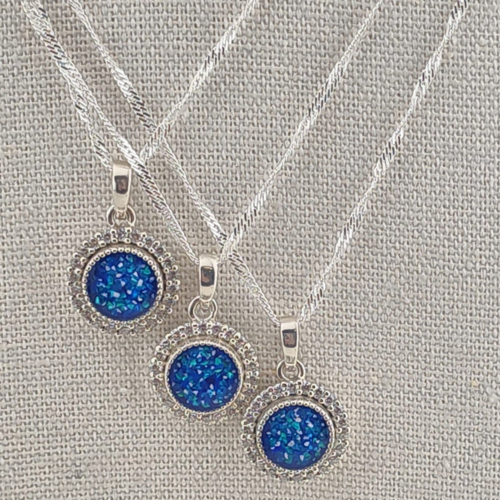 Tilly & Co Memorial Jewellery Ltd Celestia sterling silver memorial pendants with blue crystal halos on silver chains